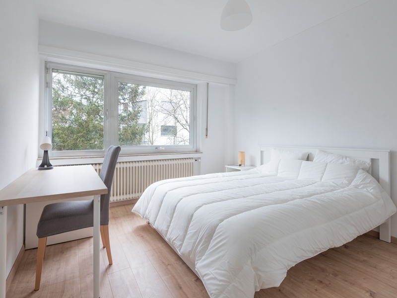 Room for Rent in a Flatshare Luxembourg. It includes double bed, desk, chair, wardrobe.