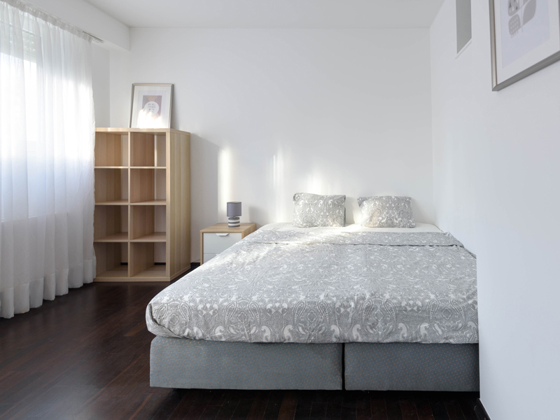 Room rent luxembourg with a double bed, shelf and bedside table