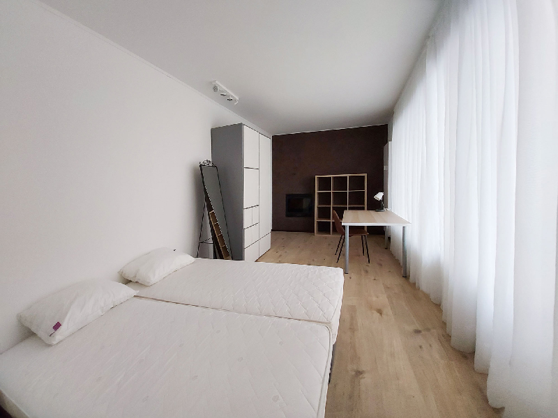 Furnished room rent Luxembourg with a double bed, wardrobe, desk, shelf