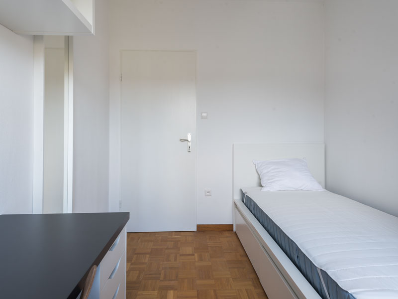 Furnished room for rent in Luxembourg. The room includes: single bed, desk, chair, shelf and wardrove.