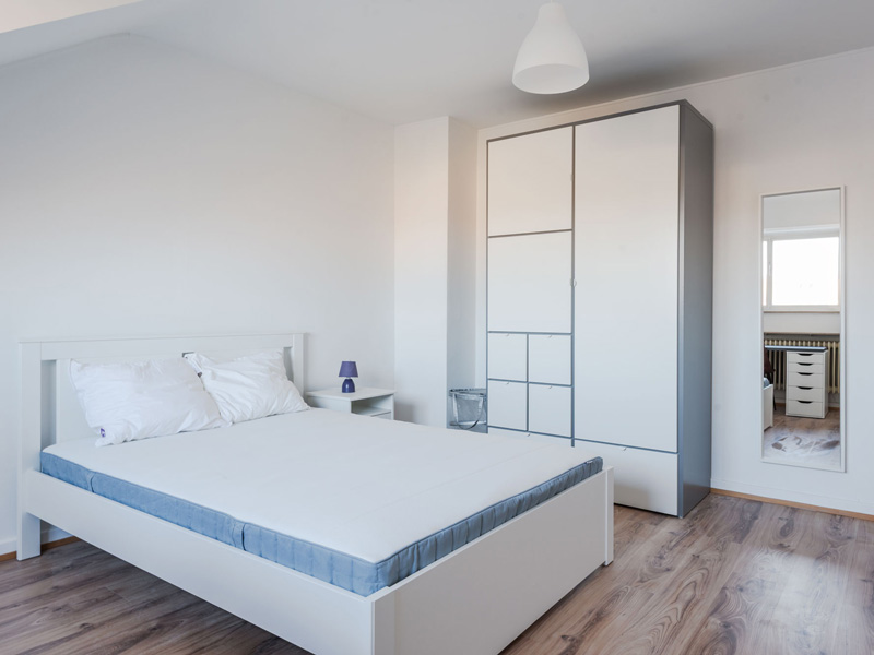 Furnished Room for Rent Luxembourg. It includes: double bed, bedside table, desk, chair, wardrobe, shelf.